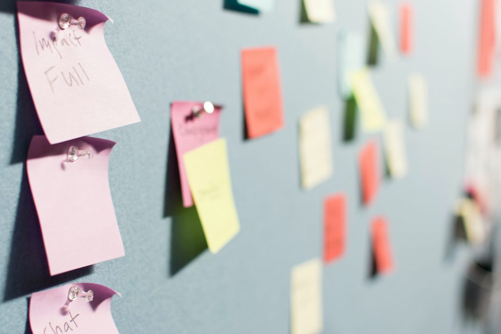 sticky notes pinned on a board